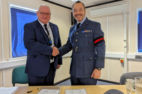 Image of Ian Roome, Liberal Democrat Parliamentary Candidate for North Devon shaking hands with Wing Commander Alex Drake