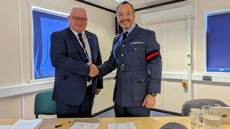 Image of Ian Roome, Liberal Democrat Parliamentary Candidate for North Devon shaking hands with Wing Commander Alex Drake